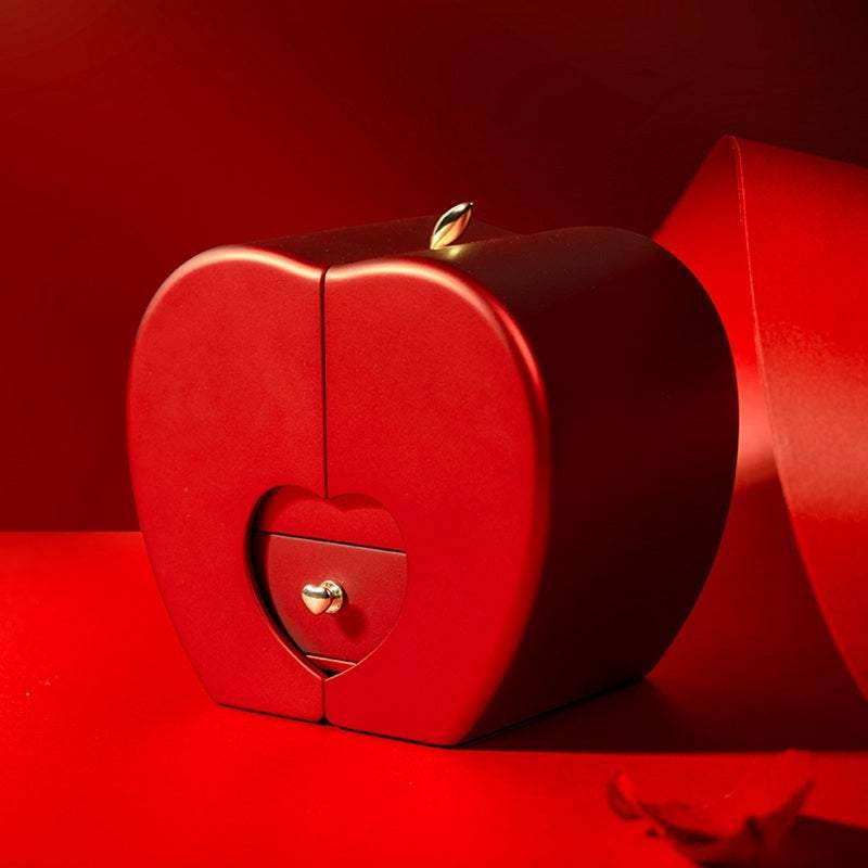 Red apple-shaped fashion jewelry box with eternal rose and necklace, perfect Christmas or Valentine's Day gift.