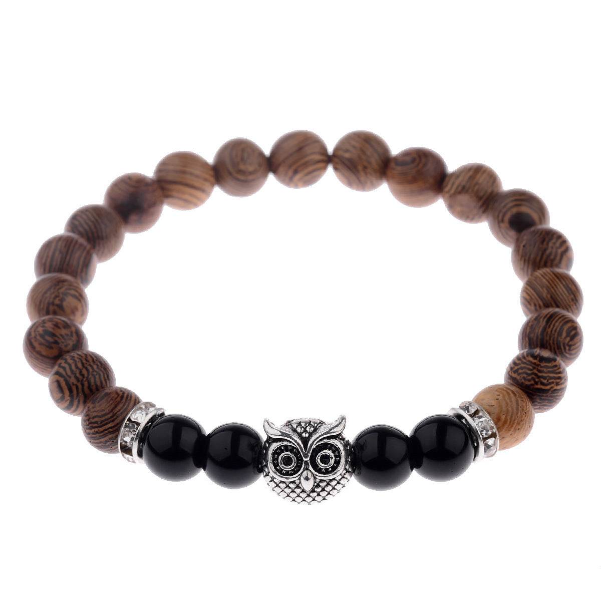 Exotic owl frosted stone bracelet with wood beads in black and gold.