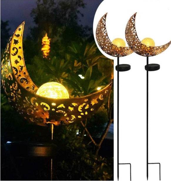 LED Solar Flame Light in decorative flame design illuminating garden at night.