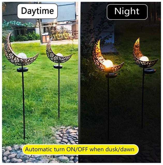 LED Solar Flame Light in decorative flame design illuminating garden at night.
