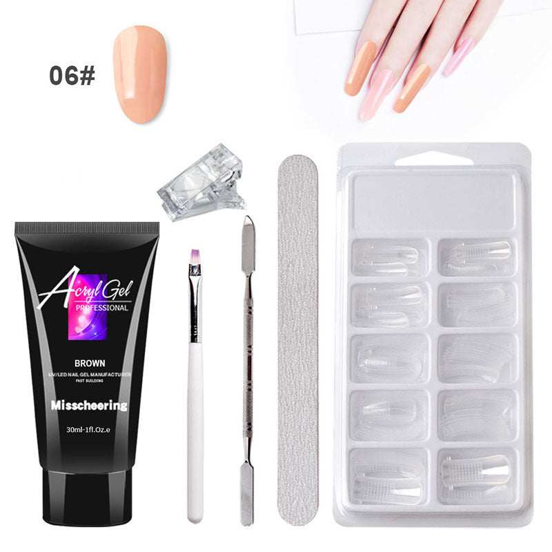 Extension Gel Nail Art Kit with accessories including UV/LED lamp, nail tools, and crystal gel.