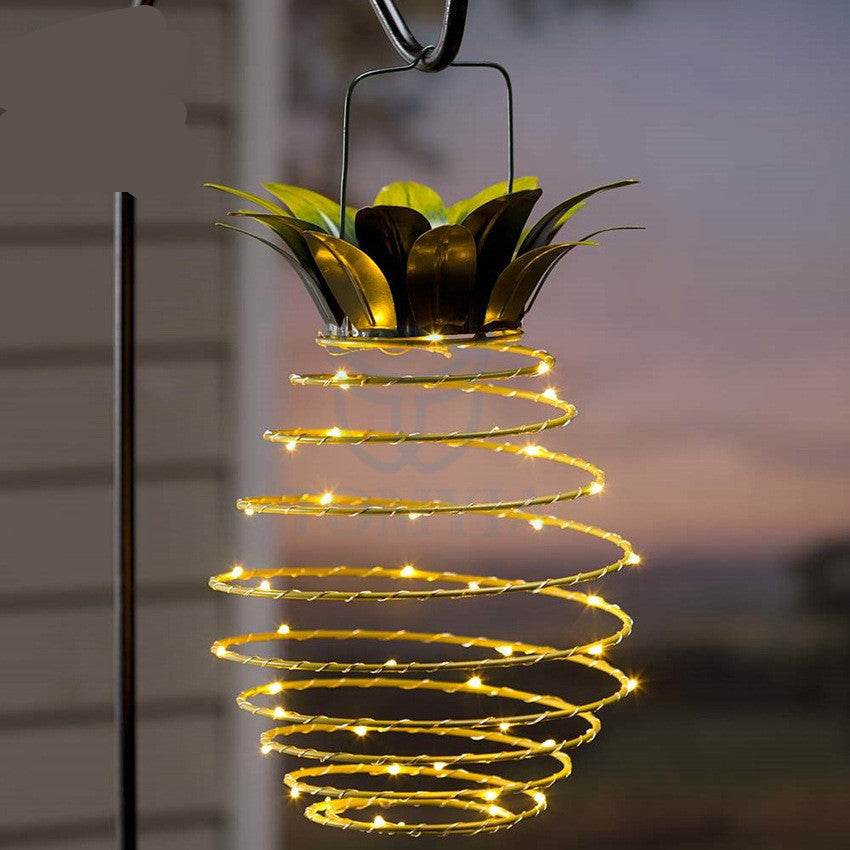 Outdoor waterproof pineapple solar lights with warm LED bulbs, ideal for garden decor.