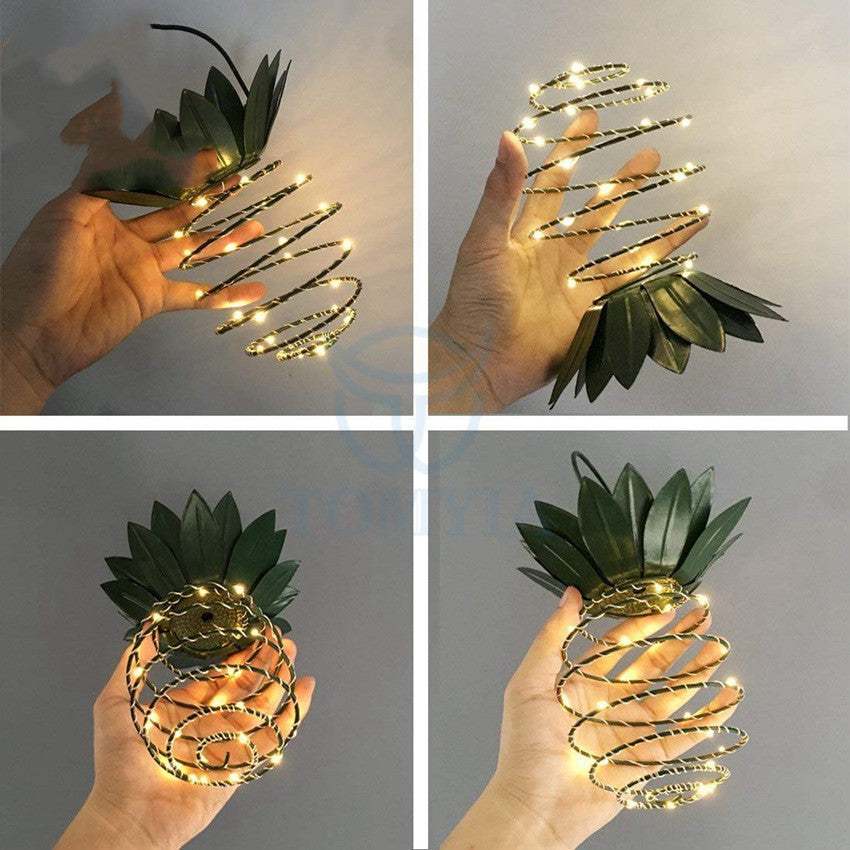 Outdoor waterproof pineapple solar lights with warm LED bulbs, ideal for garden decor.
