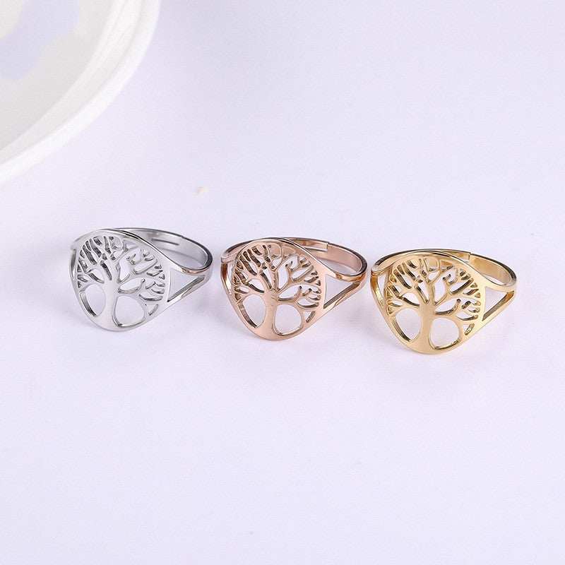 Tree of Life stainless steel rings in silver, rose gold, and gold with a retro hollow design.