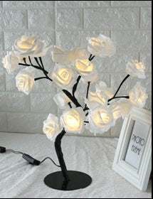 LED Tree Lamp with colorful rose-shaped lights for indoor decoration.