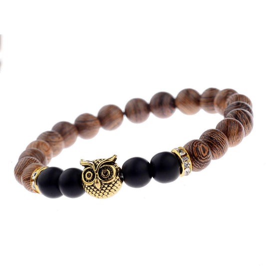 Exotic owl frosted stone bracelet with wood beads in black and gold.