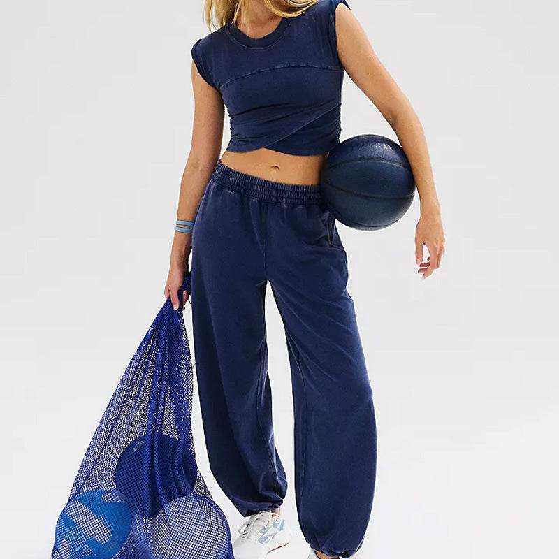 Ladies two-piece set with sleeveless top and sweatpants, dark color, casual style.
