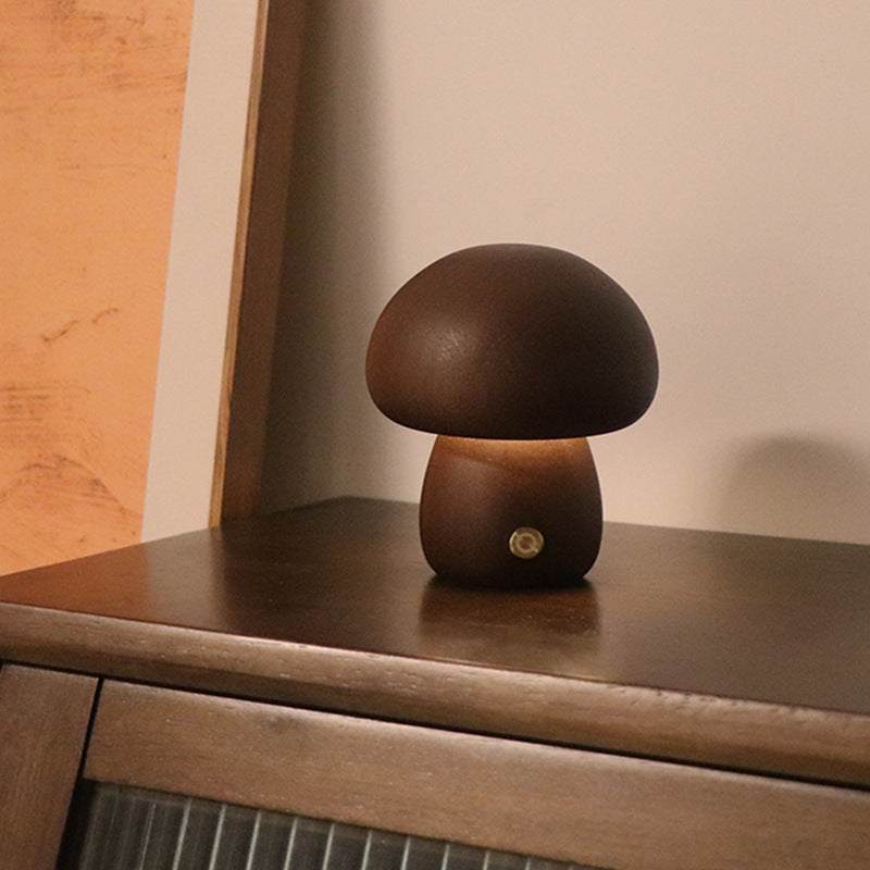Wooden cute mushroom LED night lights on a bedside table, suitable for children's room decor.