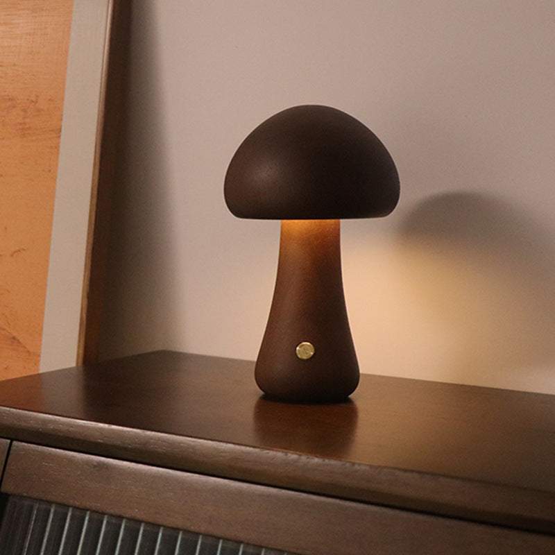 Wooden cute mushroom LED night lights on a bedside table, suitable for children's room decor.