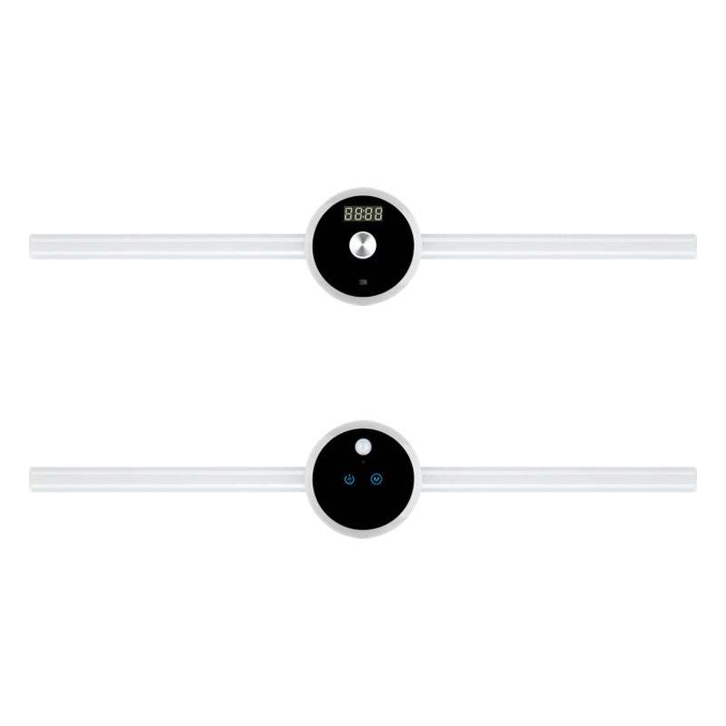 Smart cabinet light with clock and hand sweep timing feature, illuminating a wall.