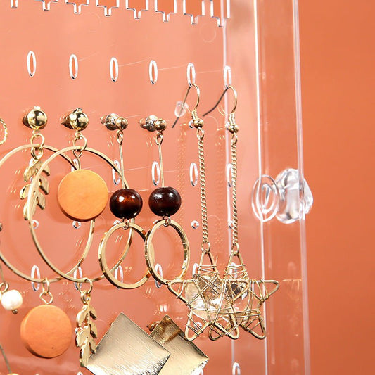 Acrylic cosmetic storage box with clear plastic design and multiple compartments for organizing makeup.