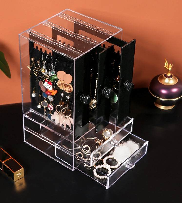 Acrylic cosmetic storage box with clear plastic design and multiple compartments for organizing makeup.