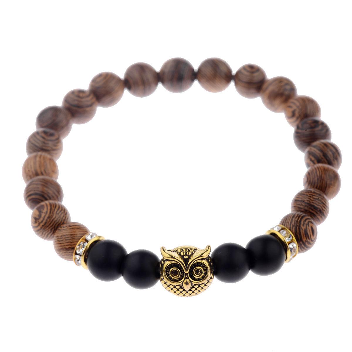 Exotic owl frosted stone bracelet with wood beads in black and gold.