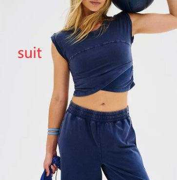 Ladies two-piece set with sleeveless top and sweatpants, dark color, casual style.
