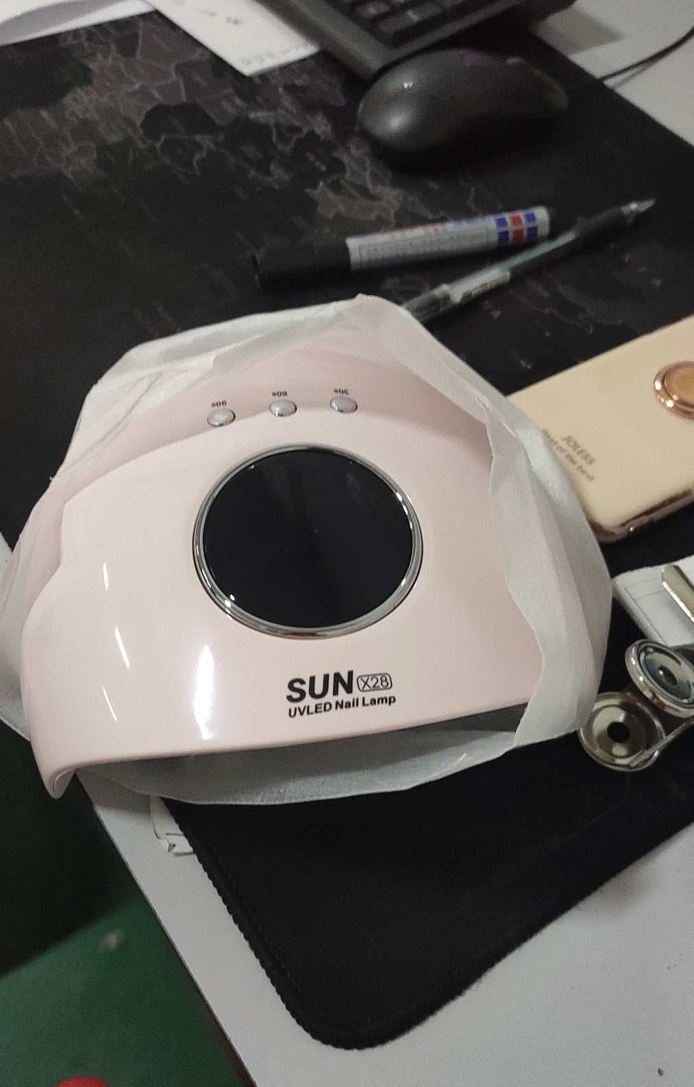 iphone 12 Pink UV LED nail lamp with digital display.