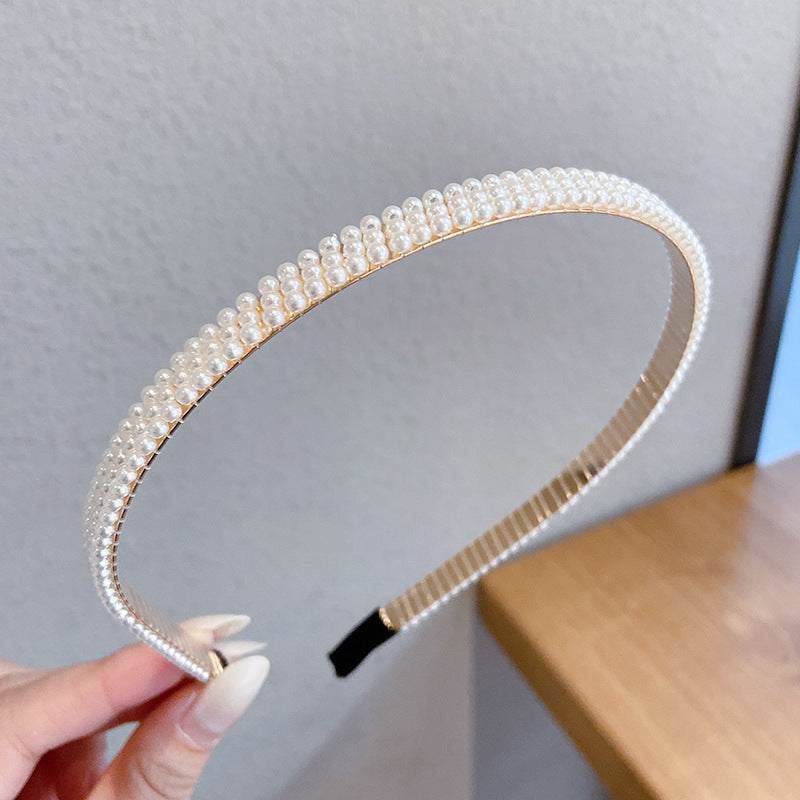 Thin pearl headbands with imitation pearls and metal, shown in a variety of designs.