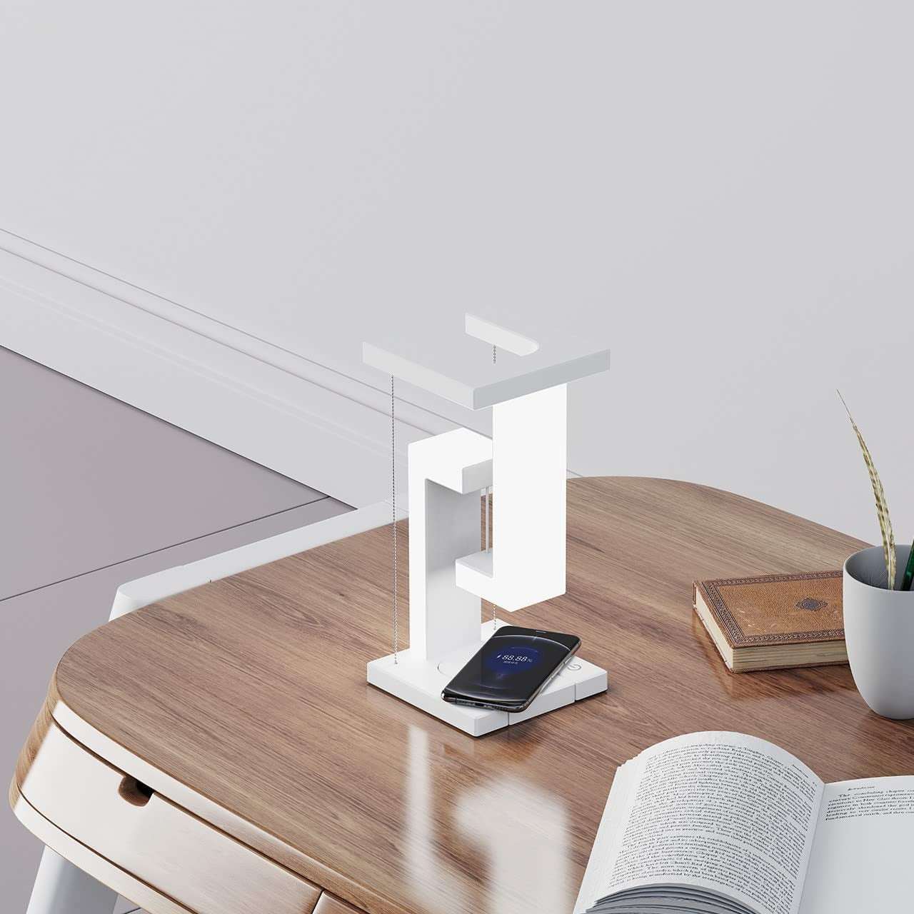 Creative smartphone wireless charging balance lamp with magnetic suspension, featuring modern design and eye protection technology.