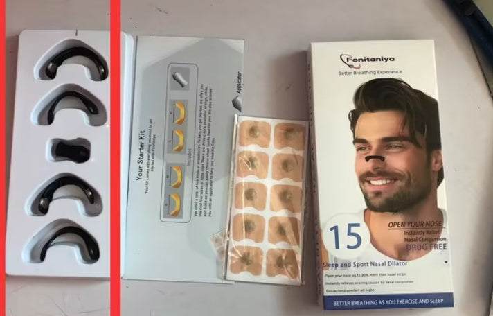 Nasal Respiratory Dilator with magnetic nose clips and adhesive strips for improved airflow.