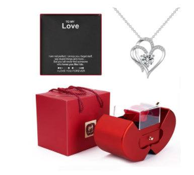 Red apple-shaped fashion jewelry box with eternal rose and necklace, perfect Christmas or Valentine's Day gift.