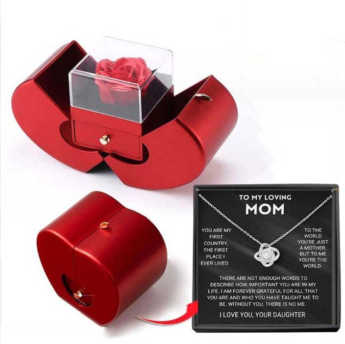 Red apple-shaped fashion jewelry box with eternal rose and necklace, perfect Christmas or Valentine's Day gift.