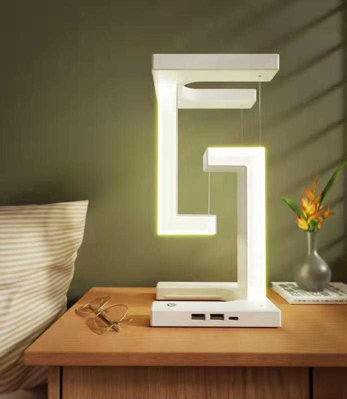 Creative smartphone wireless charging balance lamp with magnetic suspension, featuring modern design and eye protection technology.