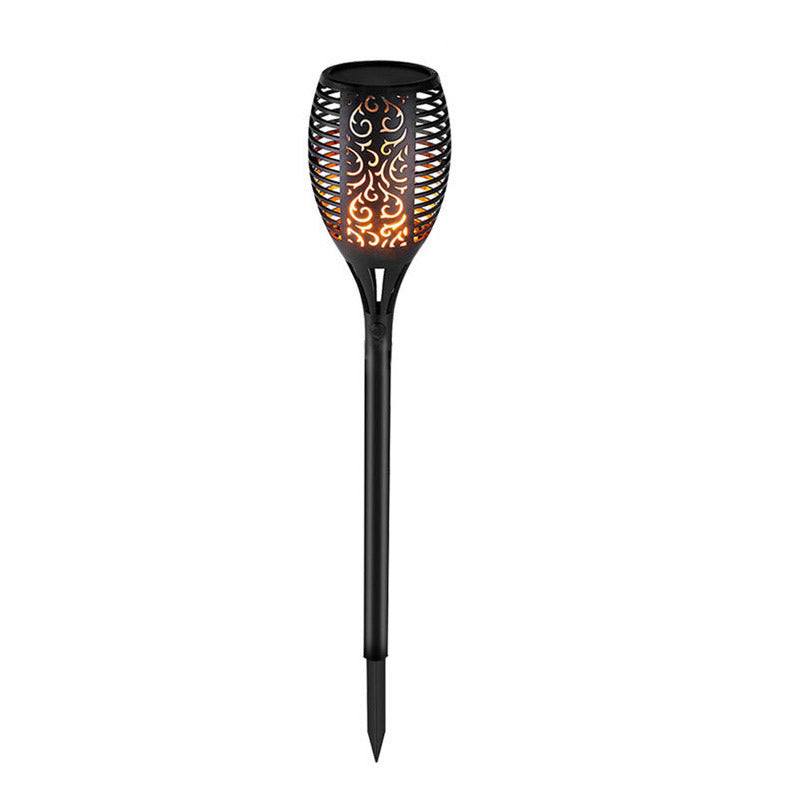 Outdoor pathway illuminated by LED waterproof solar torch lights with warm, flickering glow.