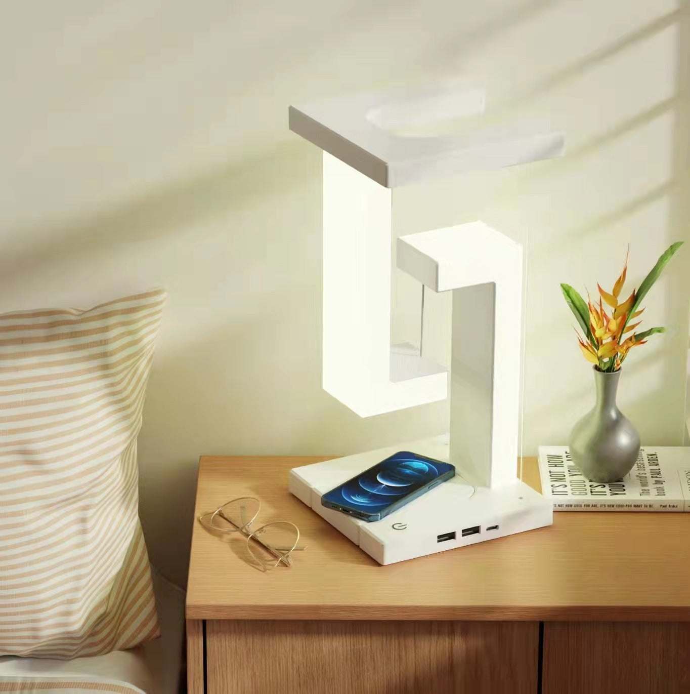 Creative smartphone wireless charging balance lamp with magnetic suspension, featuring modern design and eye protection technology.