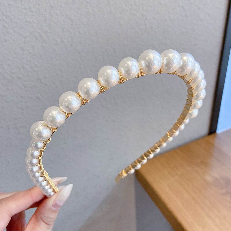 Thin pearl headbands with imitation pearls and metal, shown in a variety of designs.
