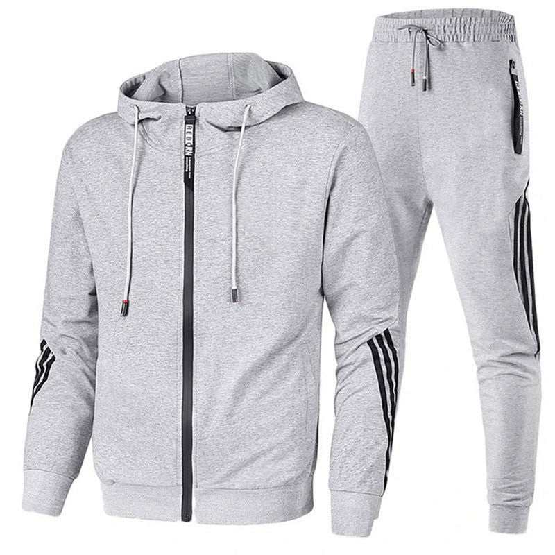 Men's leisure sports suit in navy blue with orange accents, hooded long-sleeve top, and trousers, suitable for spring and autumn.