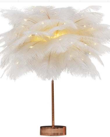 Nordic feather lamp with warm LED lights on a wooden base, perfect for bedroom decoration.