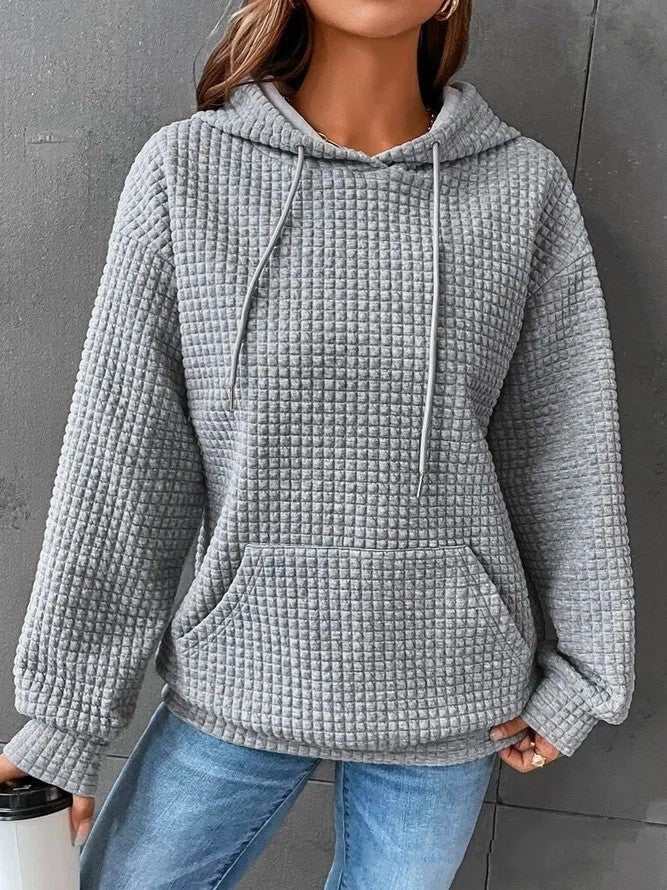 Women's loose casual solid color long-sleeved sweater with hood, available in multiple colors.