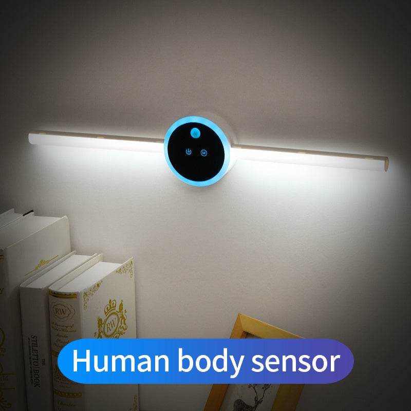 Smart cabinet light with clock and hand sweep timing feature, illuminating a wall.