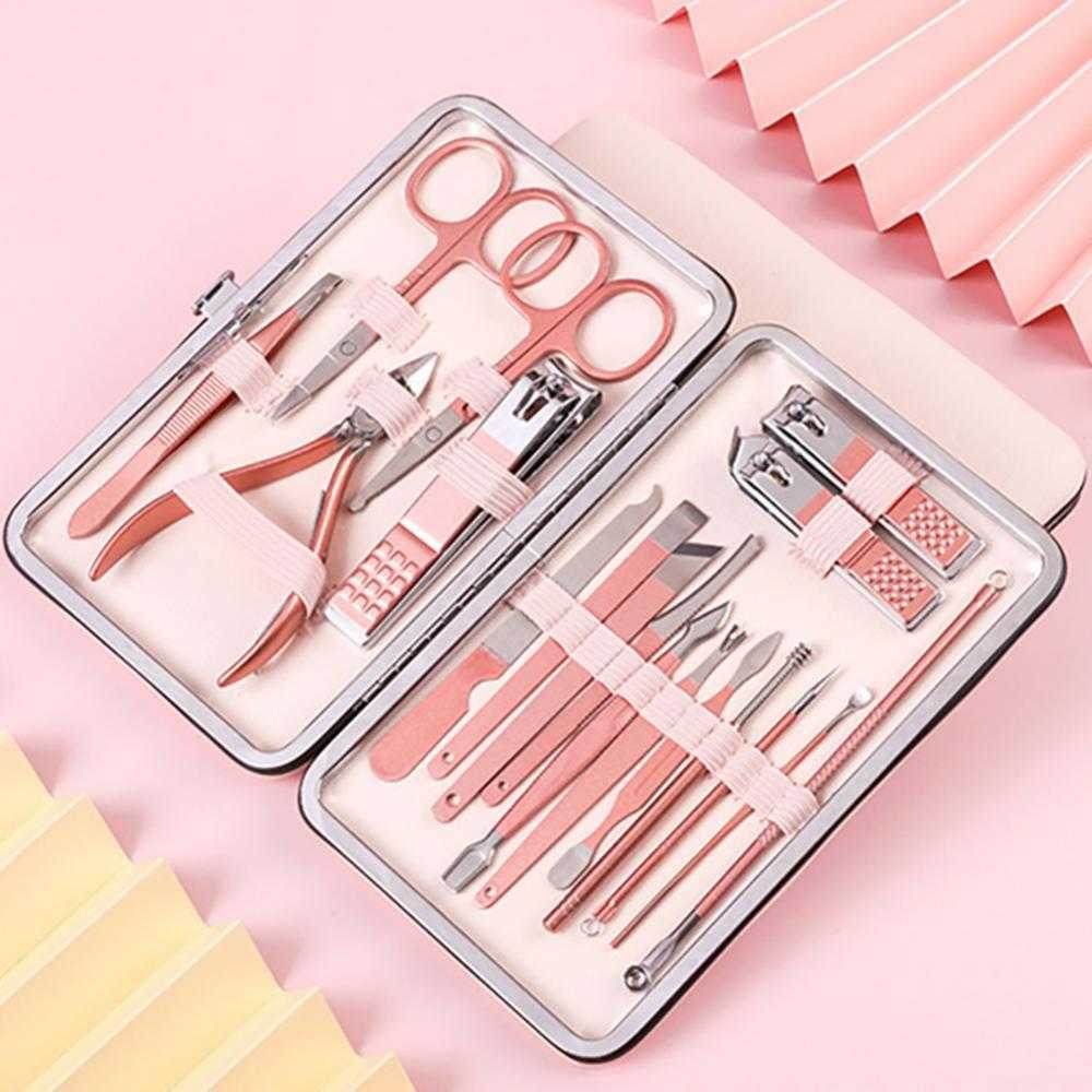 Professional nail clippers set with high-quality stainless steel tools in a rose gold leather case.