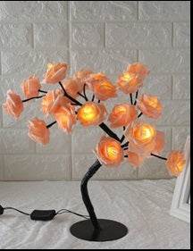 LED Tree Lamp with colorful rose-shaped lights for indoor decoration.