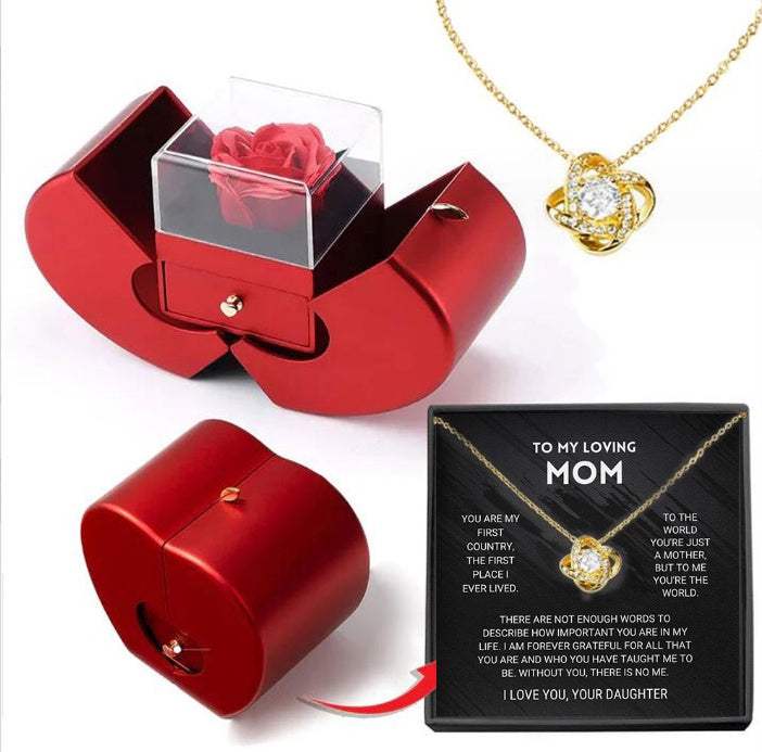 Red apple-shaped fashion jewelry box with eternal rose and necklace, perfect Christmas or Valentine's Day gift.