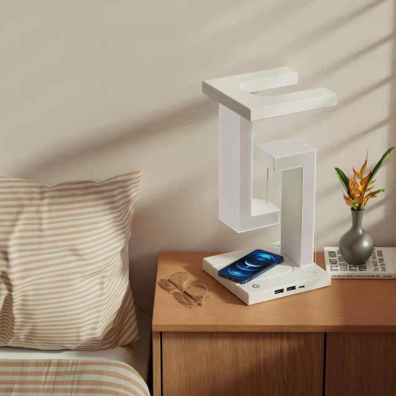 Creative smartphone wireless charging balance lamp with magnetic suspension, featuring modern design and eye protection technology.