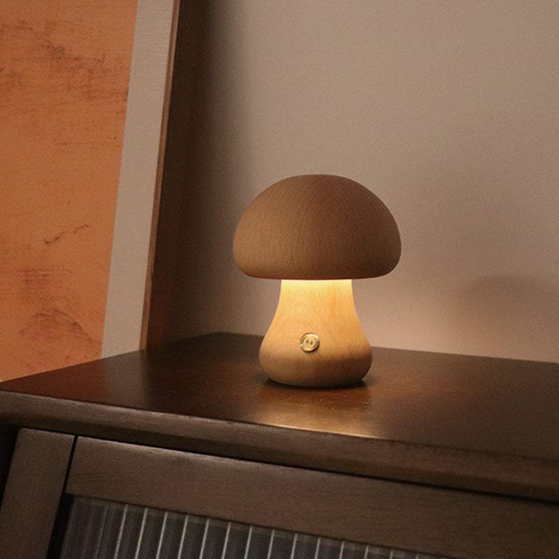 Wooden cute mushroom LED night lights on a bedside table, suitable for children's room decor.