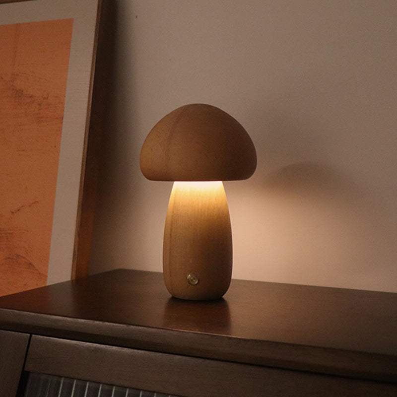 Wooden cute mushroom LED night lights on a bedside table, suitable for children's room decor.