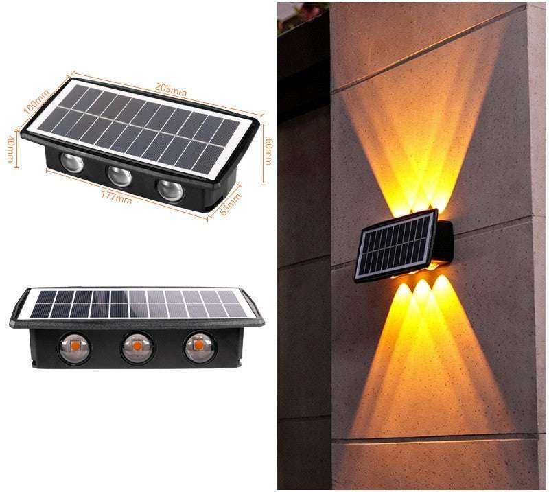 Solar outdoor wall lights illuminating a stone wall with warm light.