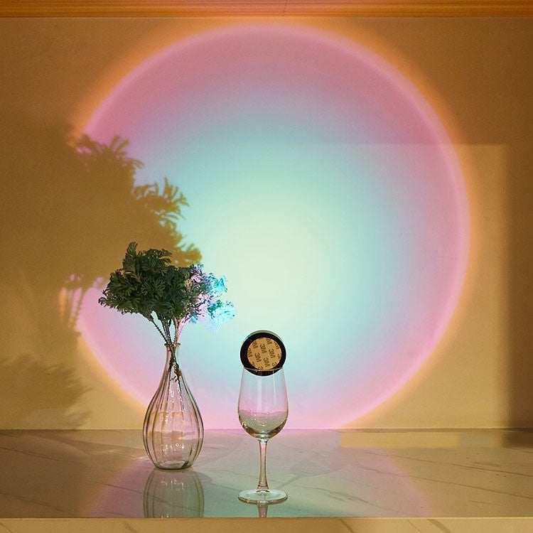 LED lights under cabinet creating colorful sunset effect in a kitchen setting.