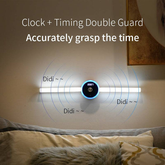 Smart cabinet light with clock and hand sweep timing feature, illuminating a wall.