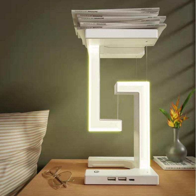 Creative smartphone wireless charging balance lamp with magnetic suspension, featuring modern design and eye protection technology.