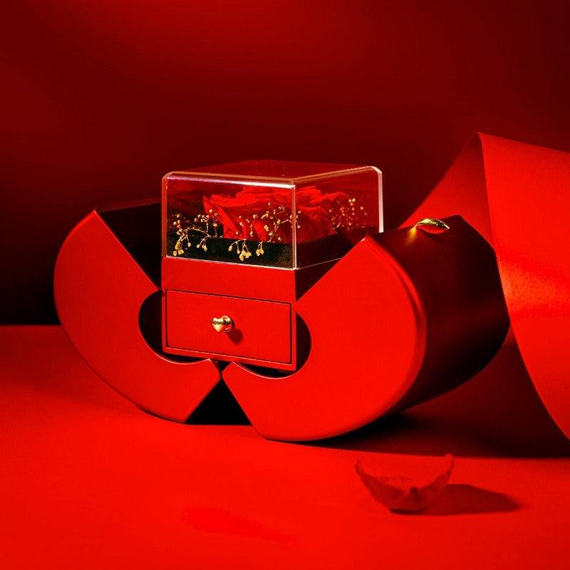 Red apple-shaped fashion jewelry box with eternal rose and necklace, perfect Christmas or Valentine's Day gift.