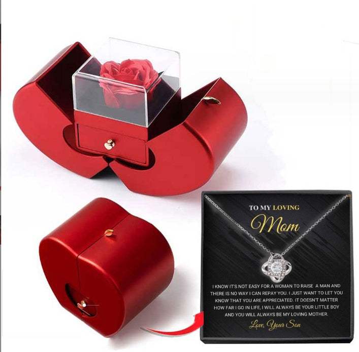 Red apple-shaped fashion jewelry box with eternal rose and necklace, perfect Christmas or Valentine's Day gift.