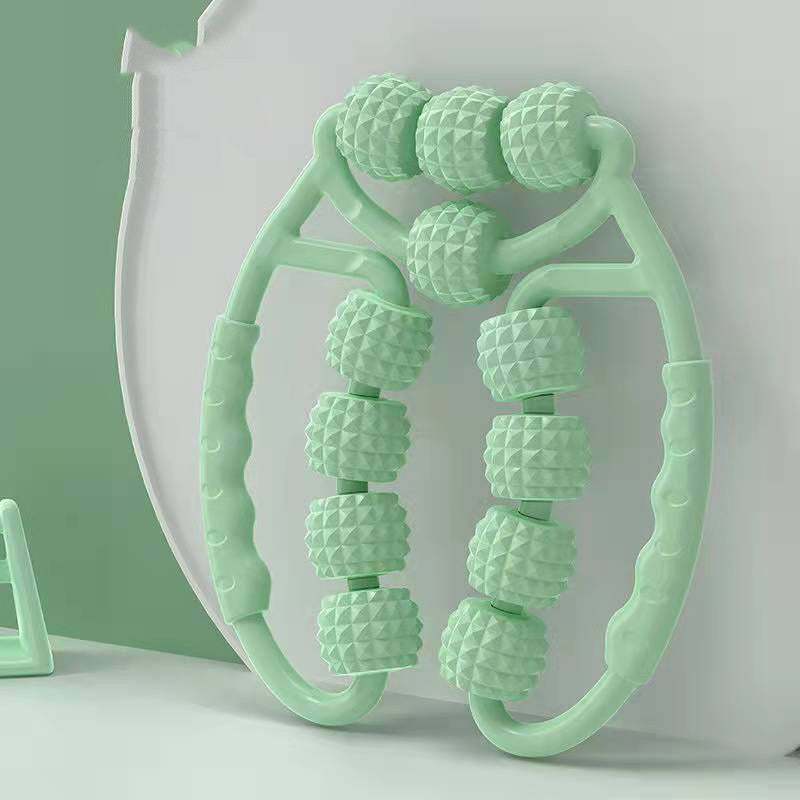 Muscle Relaxation Ring Leg Clip Roller in pink with textured rollers for massage therapy.