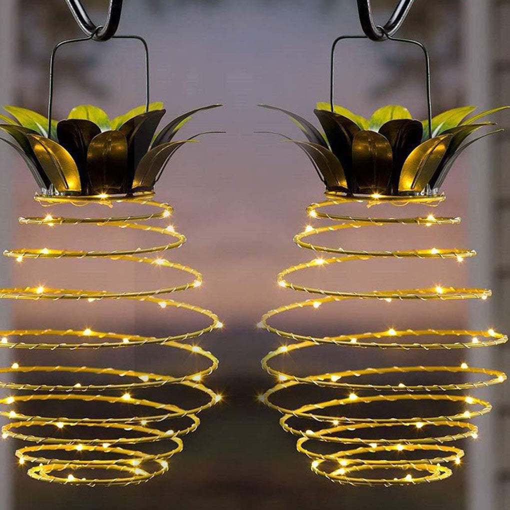 Outdoor waterproof pineapple solar lights with warm LED bulbs, ideal for garden decor.