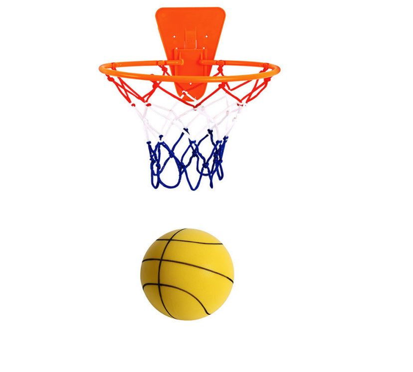 Child playing with Silent Sports Ball indoor basketball set, featuring vibrant bouncy balls in various colors and a hoop.