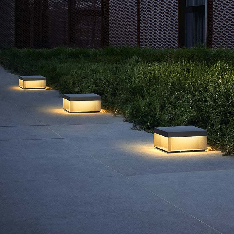 Waterproof solar garden lights illuminating a gravel pathway.