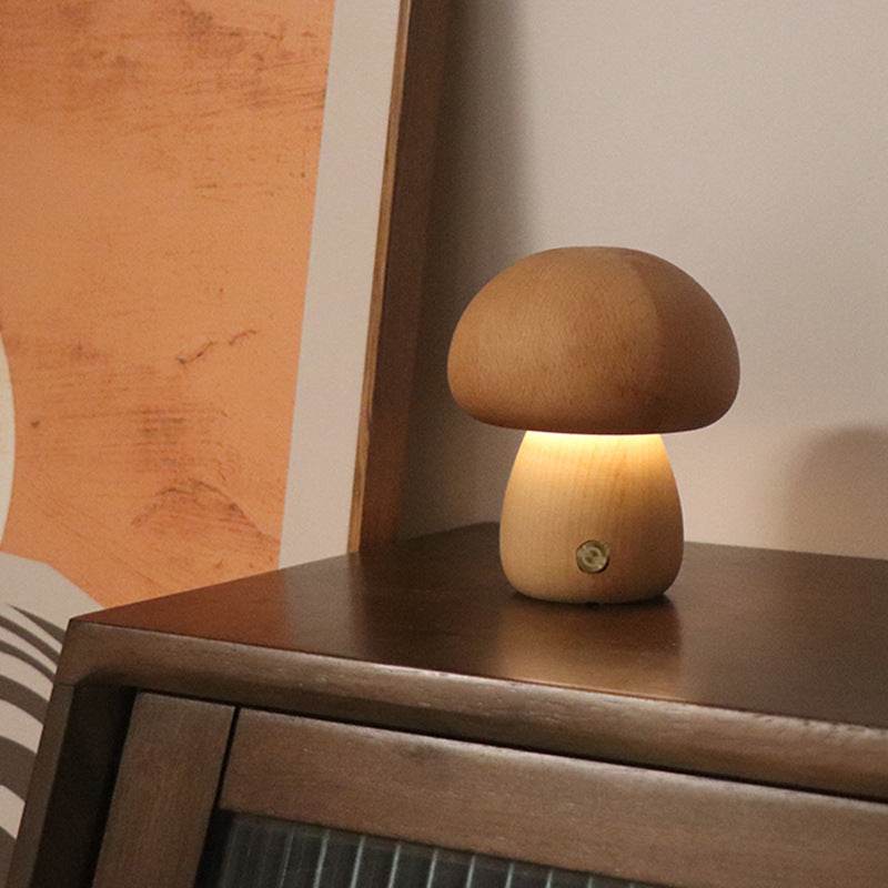 Wooden cute mushroom LED night lights on a bedside table, suitable for children's room decor.