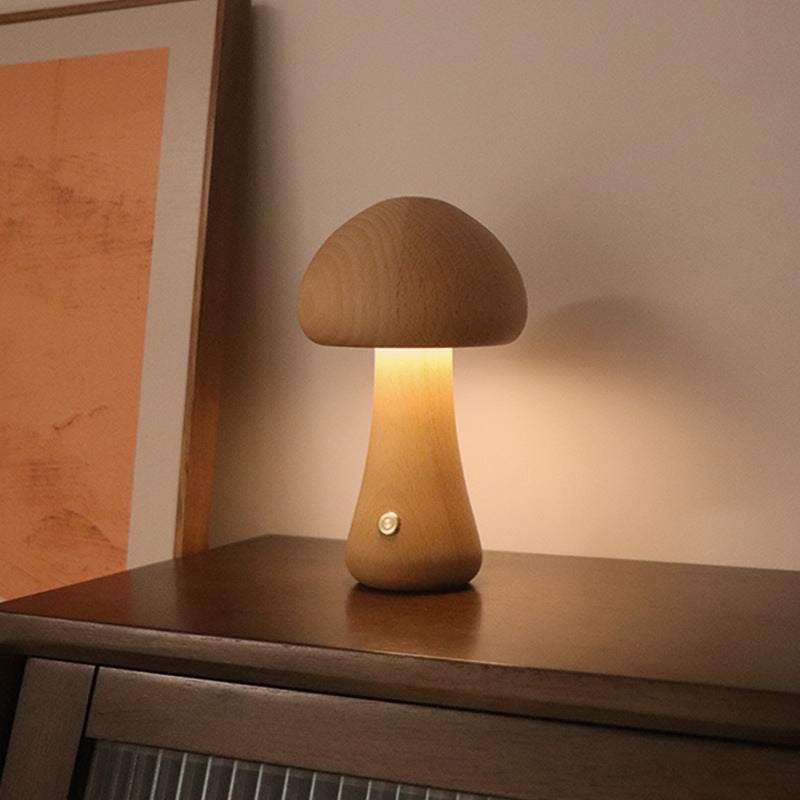Wooden cute mushroom LED night lights on a bedside table, suitable for children's room decor.